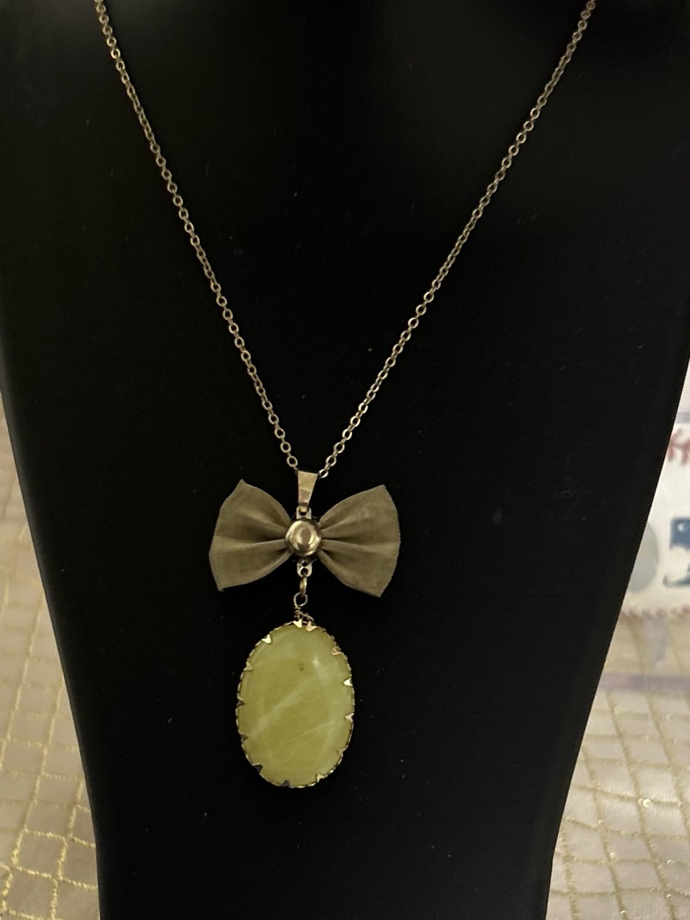 Bow Pendant Necklace with Light Green Oval Stone